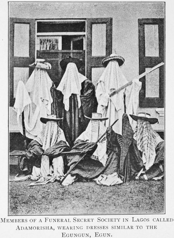 Members of a Funeral Secret Society in Lagos called Adamorisha, wearing dresses similar to the Egungun, Egun.