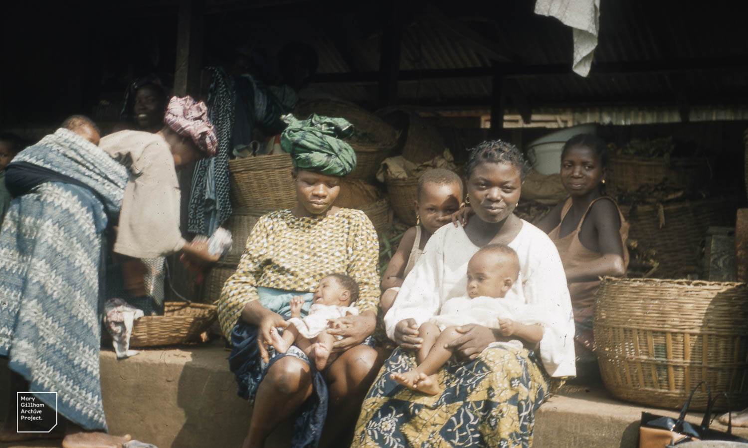 Basket sellers with babies, Yoruba. Ibadan Nigeria
